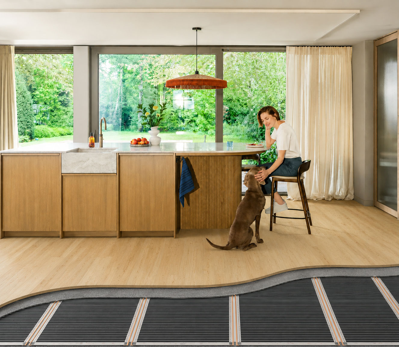 Underfloor heating mats beneath oak laminate flooring in a modern Edinburgh kitchen